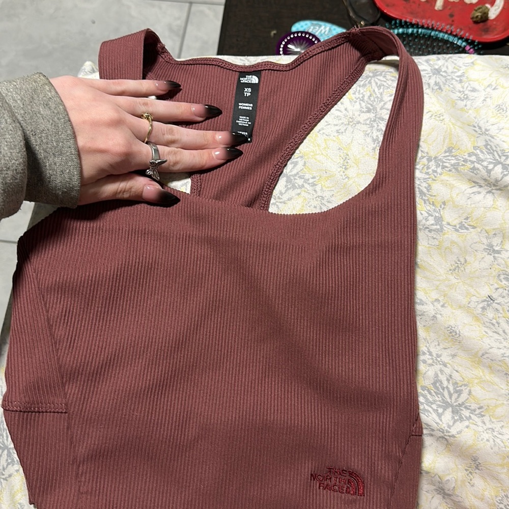 a cute north face workout top. Sadly I didn’t realize it was an xs, thank you ◕‿
